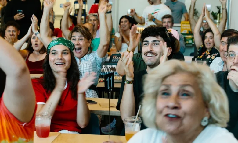 Iran diaspora watches World Cup game with protests, support