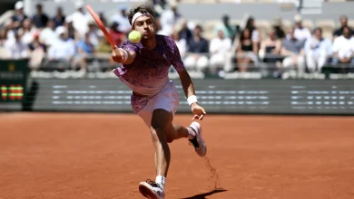 Cobolli fights into French Open last eight against dogged Svajda