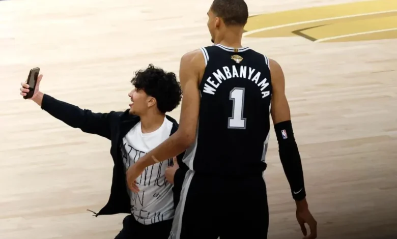 Court-storming NBA fan arrested, 'second individual' banned for life after NBA Finals selfie