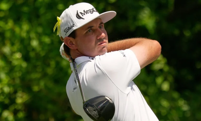 J.T. Poston handles wind to take lead at Memorial