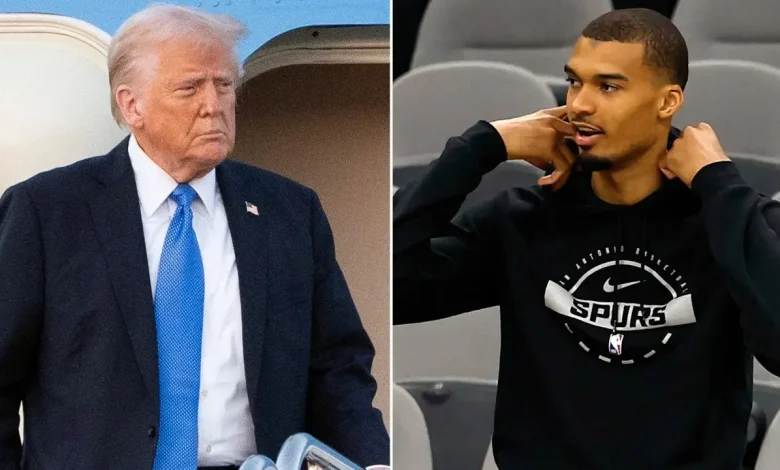 President Donald Trump reacts to Spurs star Victor Wembanyama folding his arms during the anthem