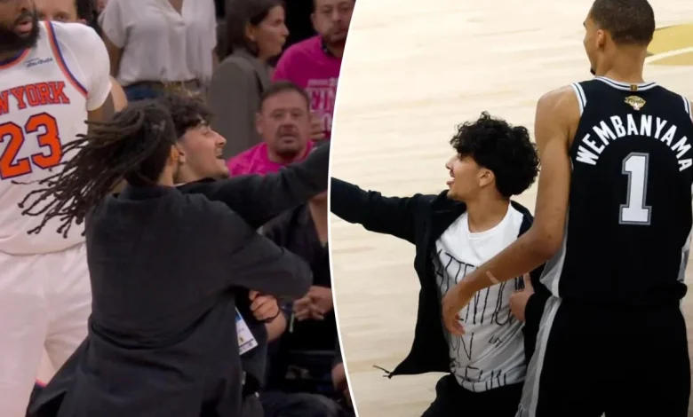 Selfie-taking fan storms court in surreal NBA Finals Game 1 scene